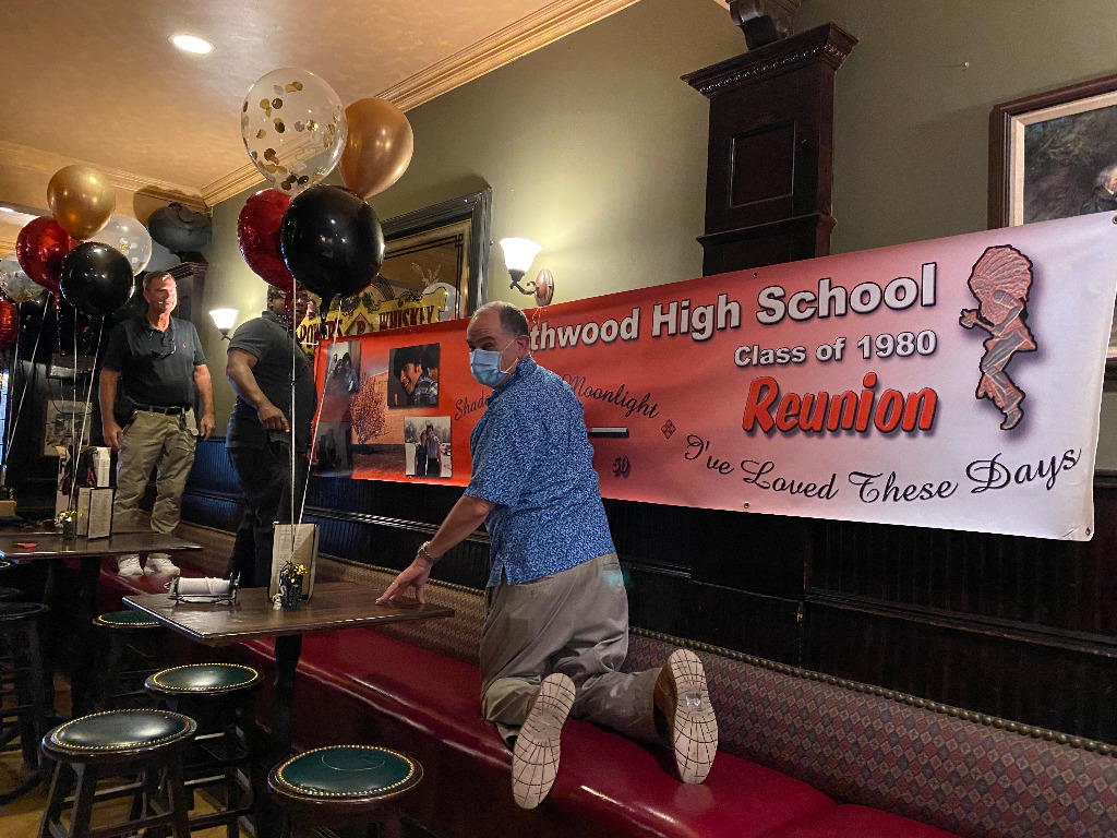 David Anderson, Michael Yette and Jay Gruber hanging the Reunion banner.