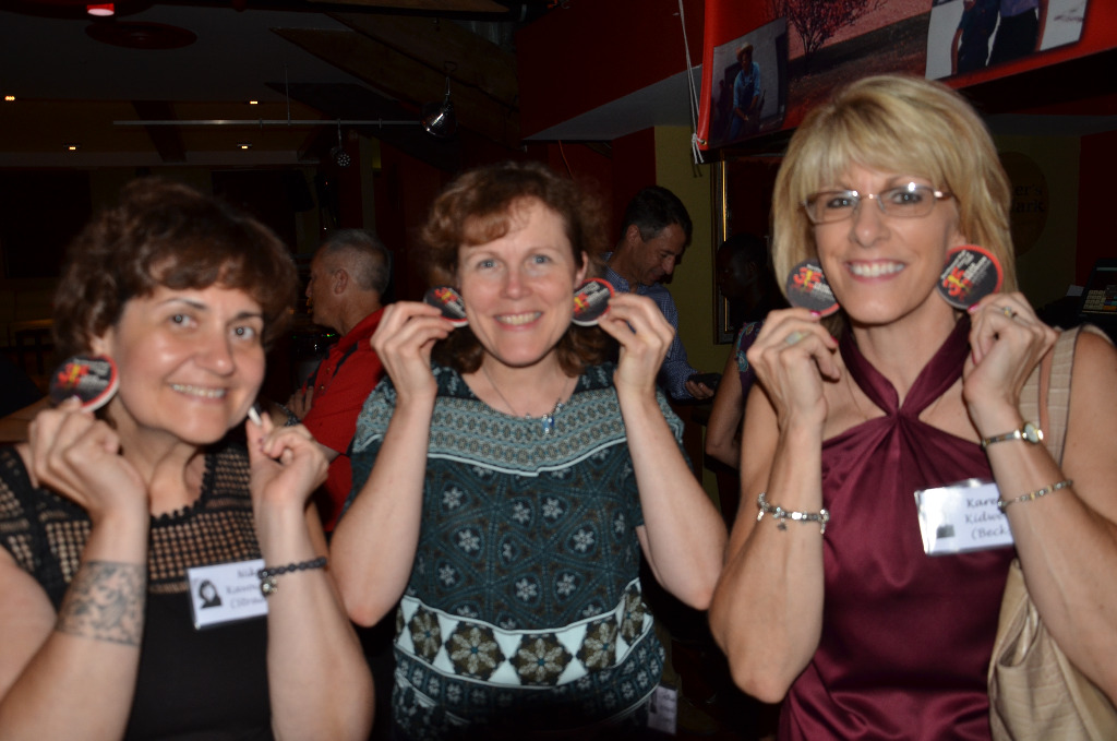 Niki Kavoures, Cindy Leonard & Karen Kidwell making earrings out of the car coasters